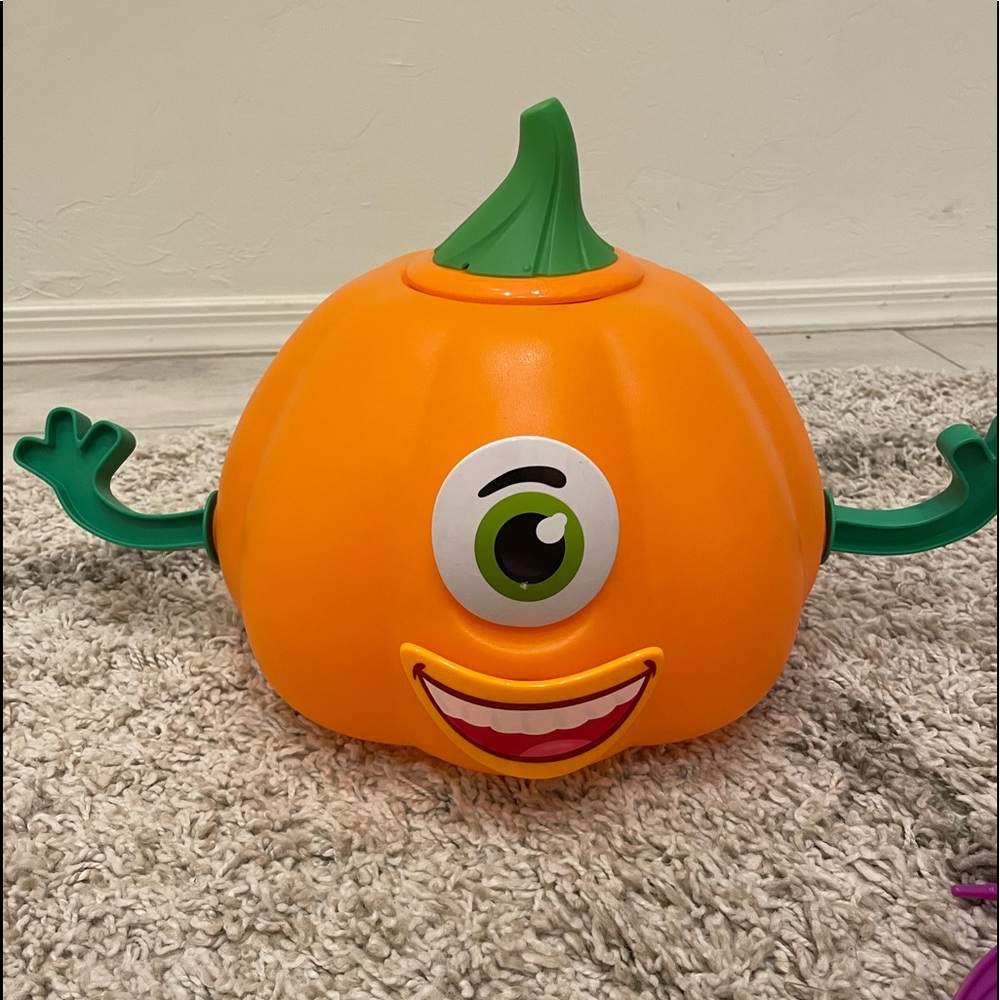 Cheerful Orange Pumpkin Toy with Green Details